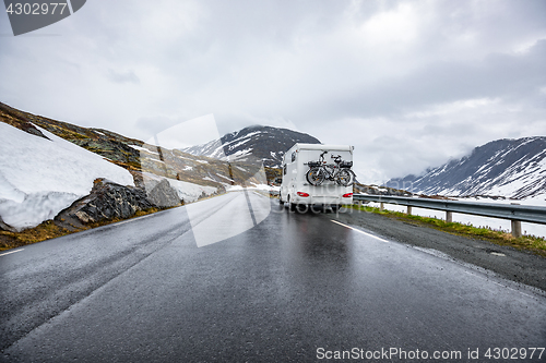 Image of Caravan car travels on the highway.