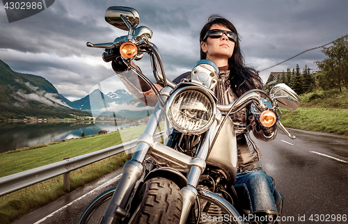 Image of Biker girl on a motorcycle