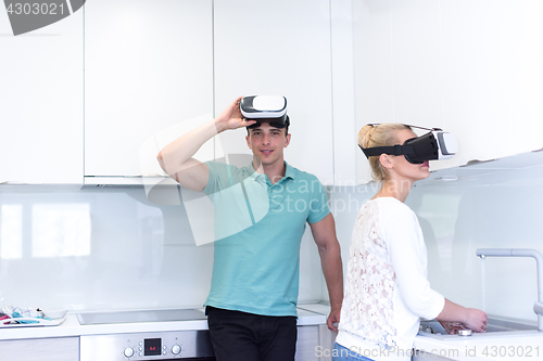 Image of young couple using VR-headset glasses of virtual reality