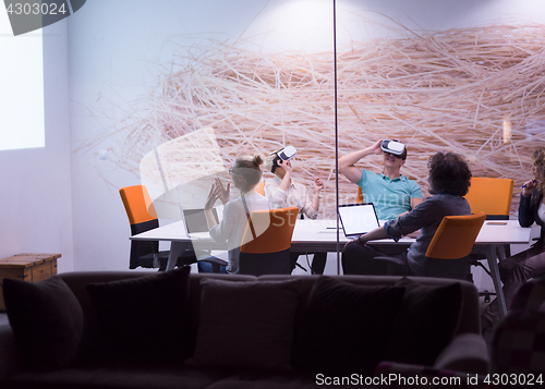 Image of startup business team using virtual reality headset