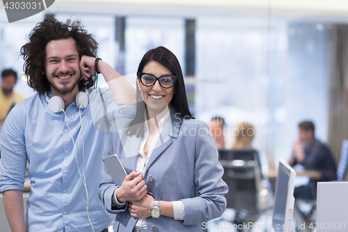 Image of Business People Working With Tablet in startup office