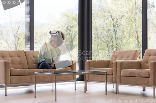 Image of black woman using VR headset glasses of virtual reality