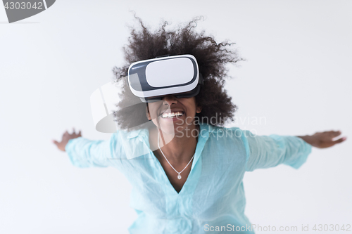 Image of black girl using VR headset glasses of virtual reality
