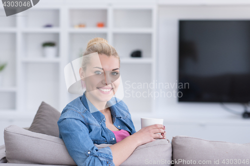 Image of woman enjoying a cup of coffee