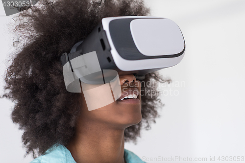 Image of black girl using VR headset glasses of virtual reality