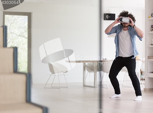 Image of man using VR-headset glasses of virtual reality