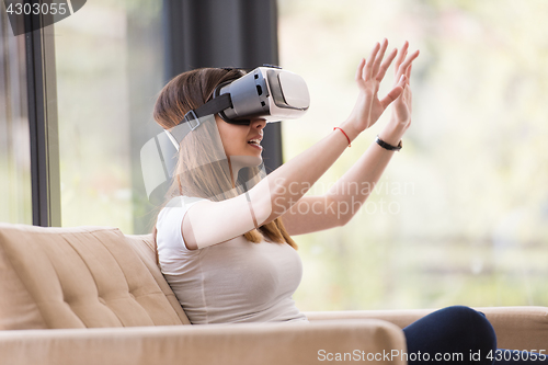 Image of woman using VR-headset glasses of virtual reality