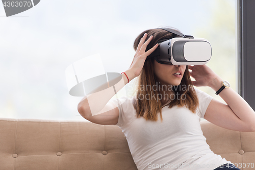 Image of woman using VR-headset glasses of virtual reality