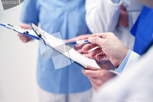 Image of close up of doctors with clipboard at hospital