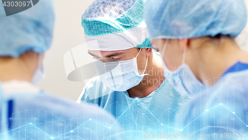 Image of group of surgeons in operating room at hospital