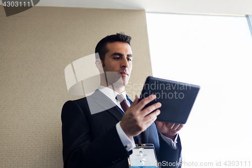 Image of businessman with tablet pc computer at office