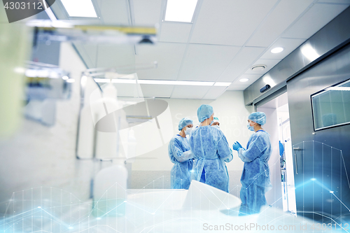 Image of group of surgeons in operating room at hospital