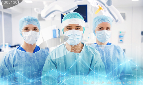 Image of group of surgeons in operating room at hospital