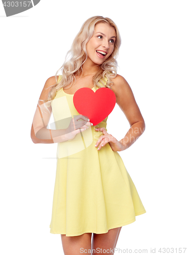 Image of happy young woman with red paper heart