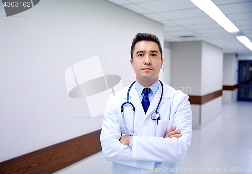 Image of doctor with stethoscope at hospital corridor