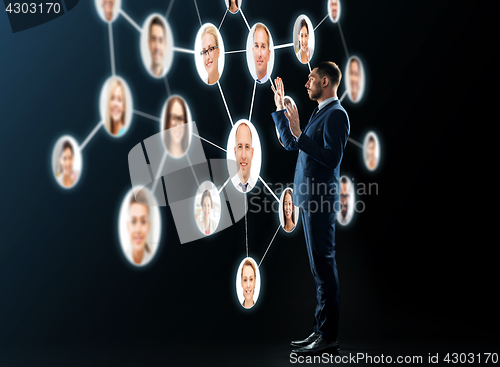 Image of buisnessman looking at contacts network