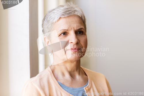 Image of portrait of happy gray senior woman