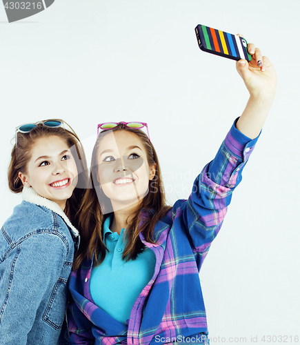 Image of best friends teenage girls together having fun, posing emotional on white background, besties happy smiling, lifestyle people concept close up