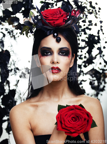 Image of pretty brunette woman with rose jewelry, black and red, bright m