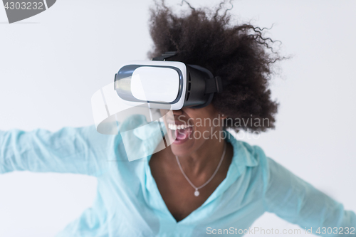 Image of black girl using VR headset glasses of virtual reality