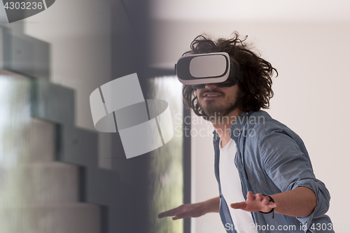 Image of man using VR-headset glasses of virtual reality