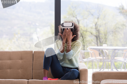 Image of black woman using VR headset glasses of virtual reality