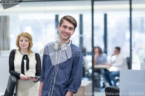 Image of Business People Working With Tablet in startup office