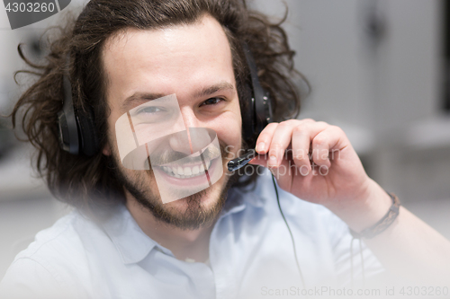 Image of male call centre operator doing his job