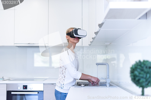 Image of woman using VR-headset glasses of virtual reality