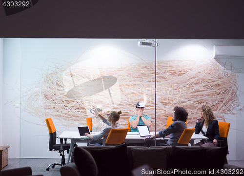 Image of startup business team using virtual reality headset