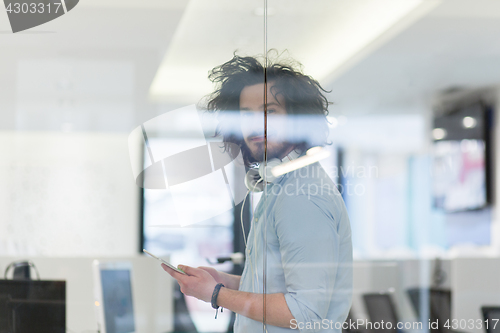 Image of businessman using tablet computer