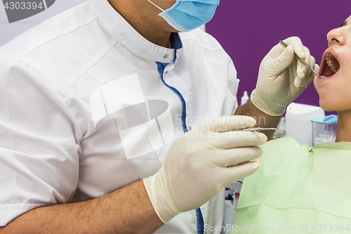 Image of Dentist working in dentist office