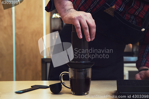 Image of Barista brewing aeropress coffee