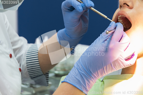 Image of Dentist working in dentist office