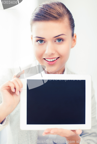 Image of businesswoman with tablet pc in office