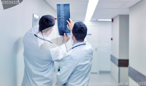 Image of medics with spine x-ray scan at hospital