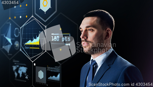 Image of businessman with virtual screen over black