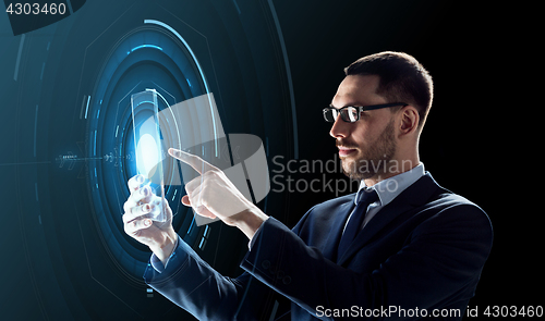 Image of businessman working with transparent tablet pc