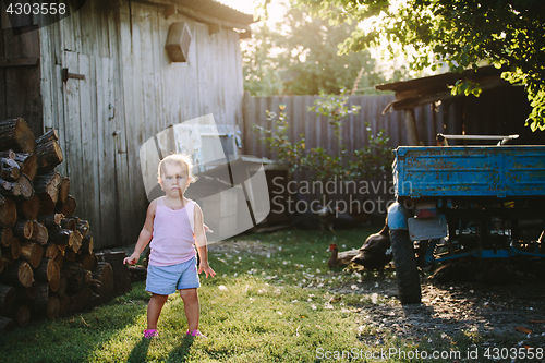 Image of Child playing in backyard