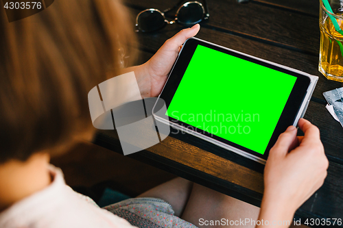 Image of Crop woman posing with tablet