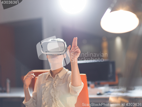 Image of businesswoman using VR-headset glasses of virtual reality