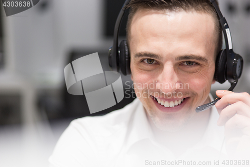 Image of male call centre operator doing his job