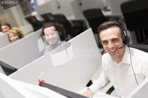 Image of male call centre operator doing his job