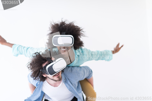 Image of multiethnic couple getting experience using VR headset glasses
