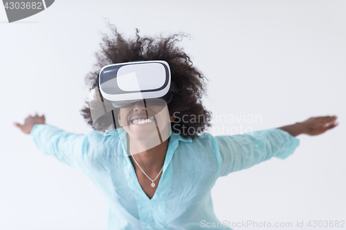 Image of black girl using VR headset glasses of virtual reality