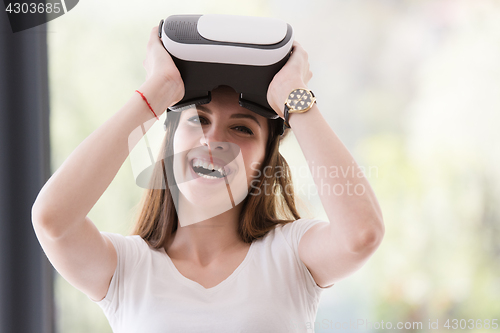 Image of woman using VR-headset glasses of virtual reality