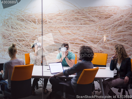 Image of startup business team using virtual reality headset