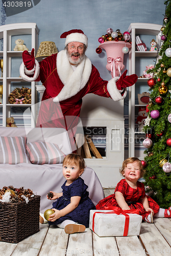 Image of The two little girls with Santa at studio with christmas decorations