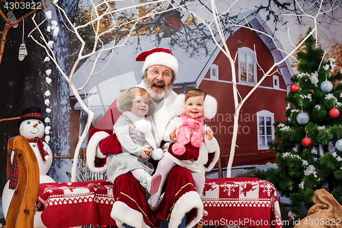 Image of The two little girls with Santa at studio with christmas decorations
