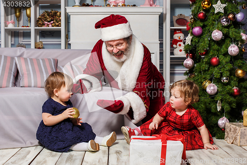 Image of The two little girls with Santa at studio with christmas decorations